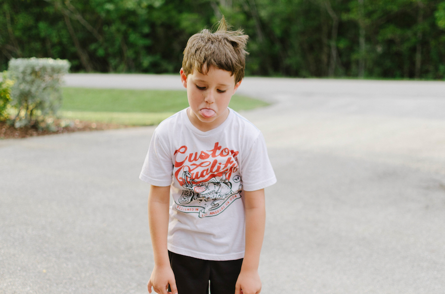 kid sticking out his tongue