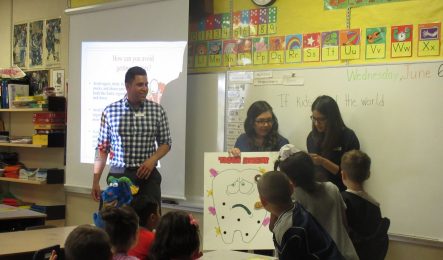 Dr. Himmat Bajwa presenting at elementary school